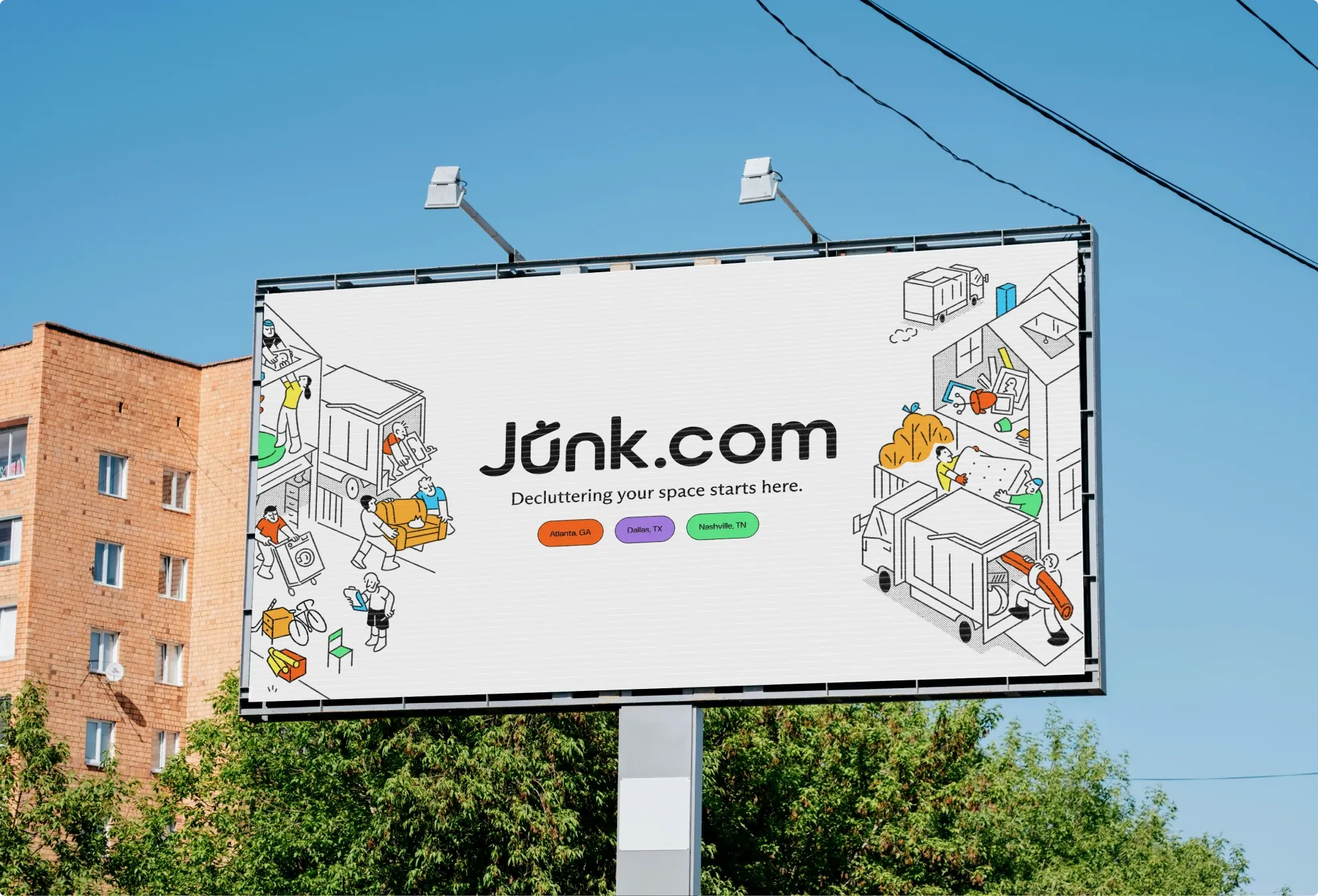 A Junk.com billboard over a city street: “Decluttering your space starts here.”