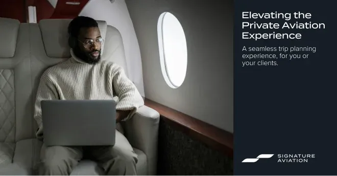 A Signature Aviation ad of a passenger working on a laptop in a jet cabin.