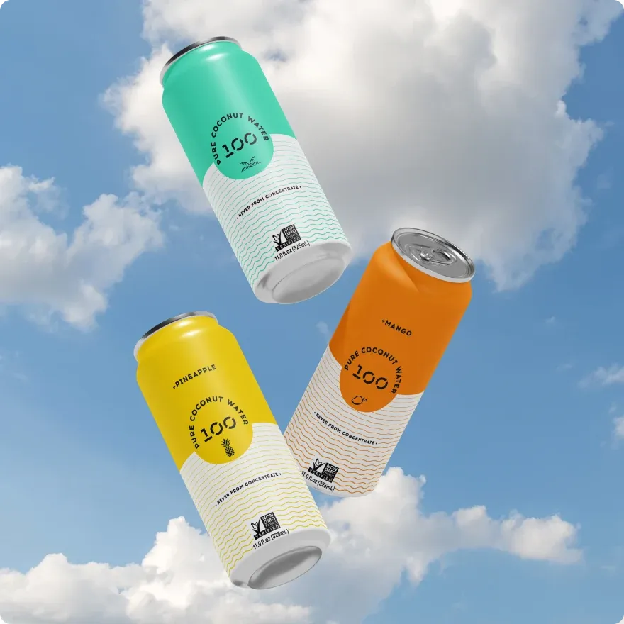 Three 100 Coconuts cans floating against a cloudy sky.