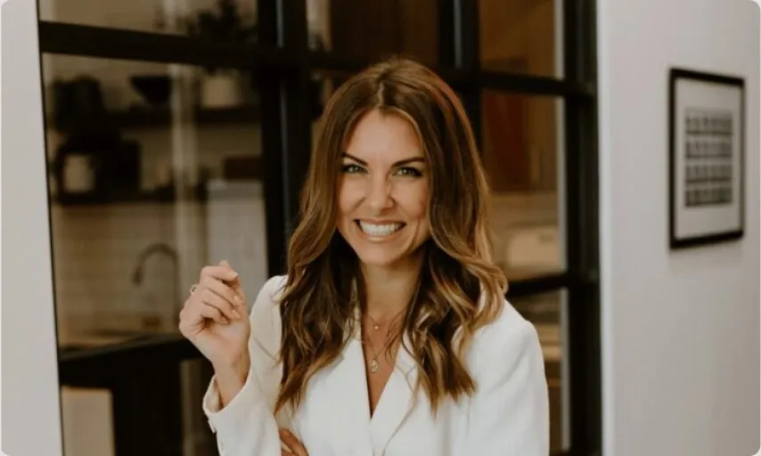 Brooke MacLean, Marketwake's CEO, smiling in the studio.