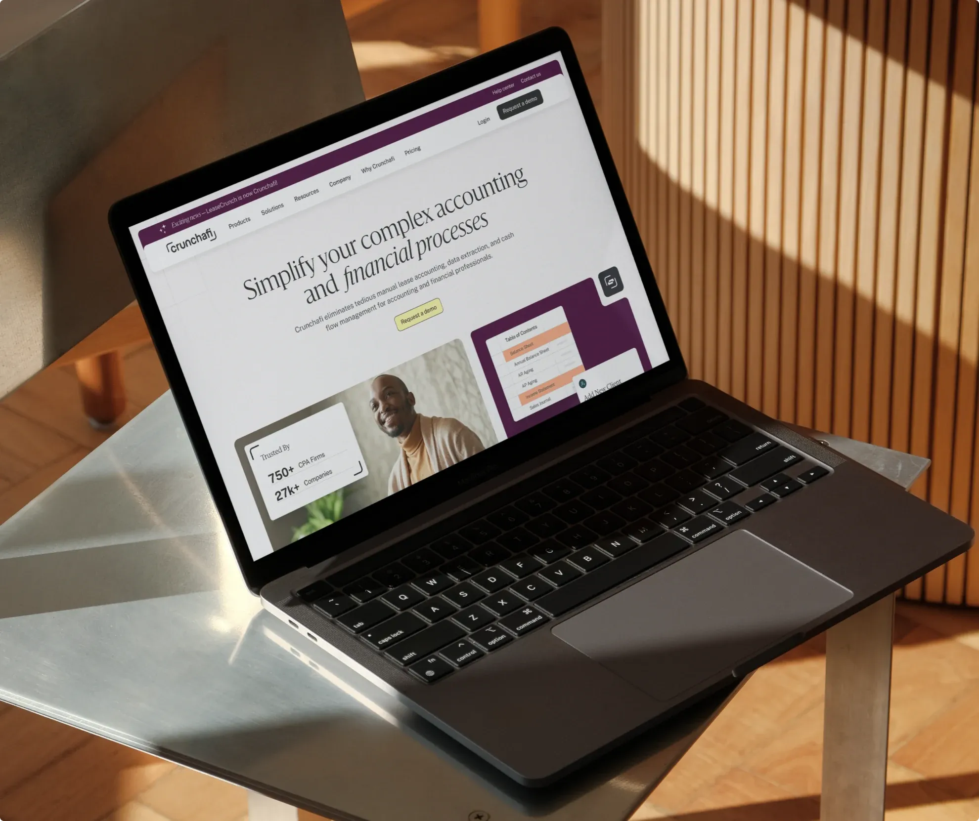 The new Crunchafi homepage on a laptop: “Simplify your complex accounting and financial processes”.